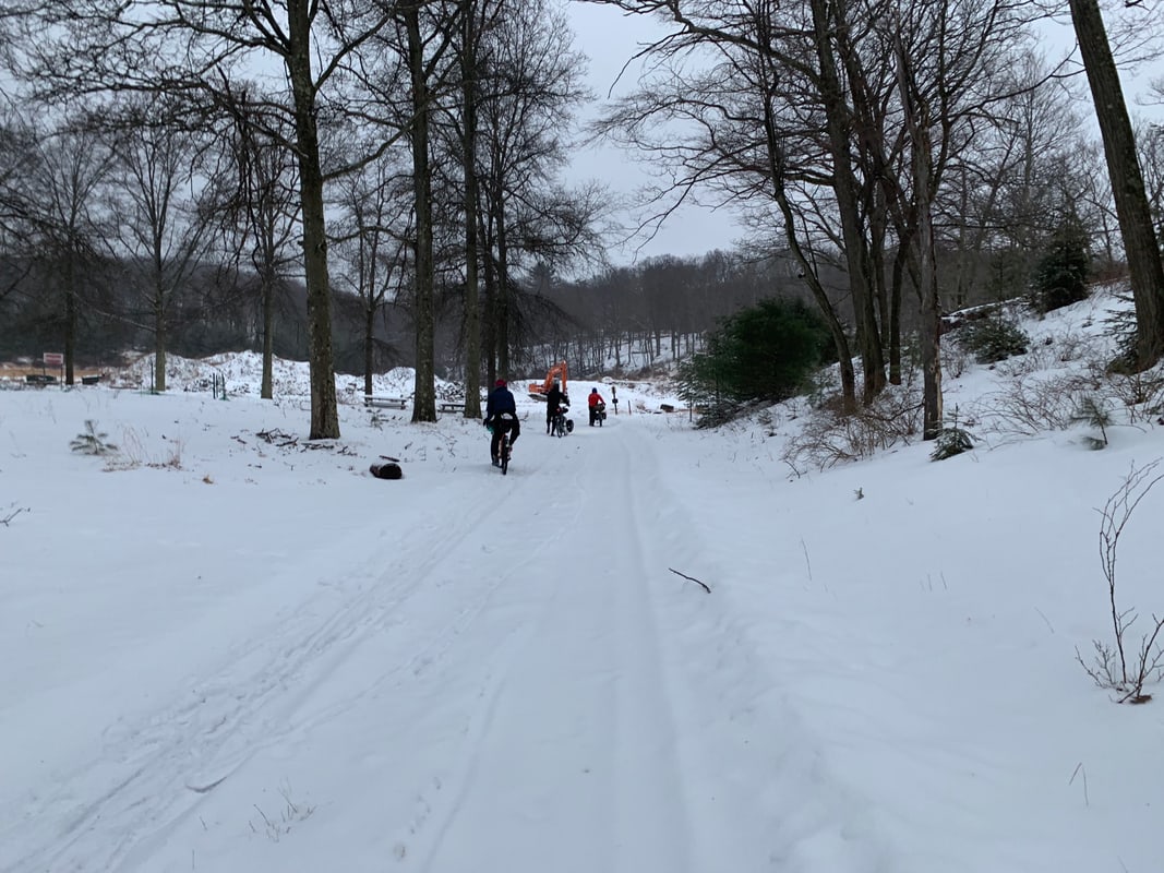 Pushing our bikes through the snow